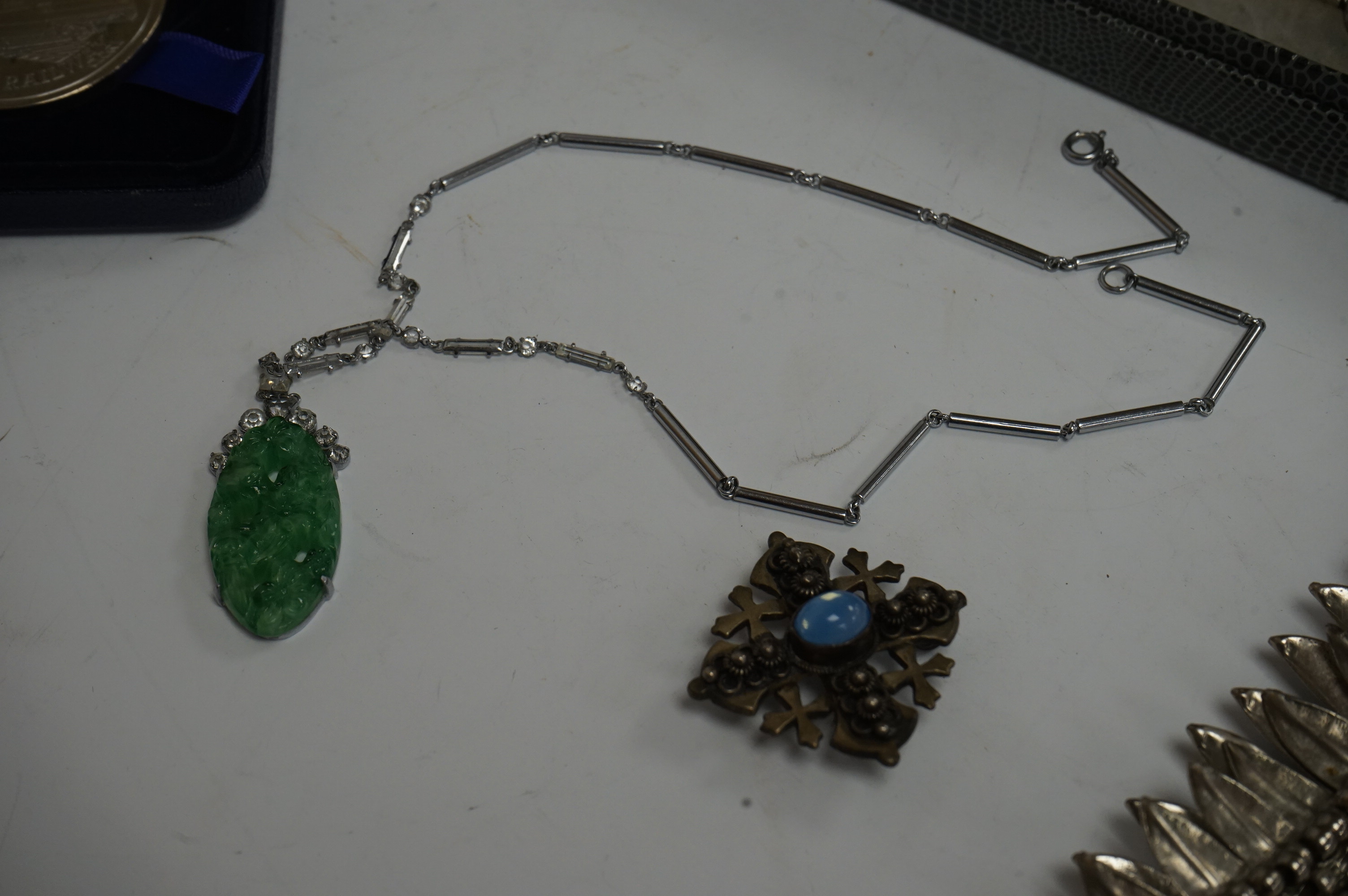 Assorted jewellery including a boxed Lalique domed glass link bracelet, overall 18.4cm, a simulated jade and simulated diamond set pendant necklace, a white metal leaf bracelet, a 900 standard white metal and blue chalce